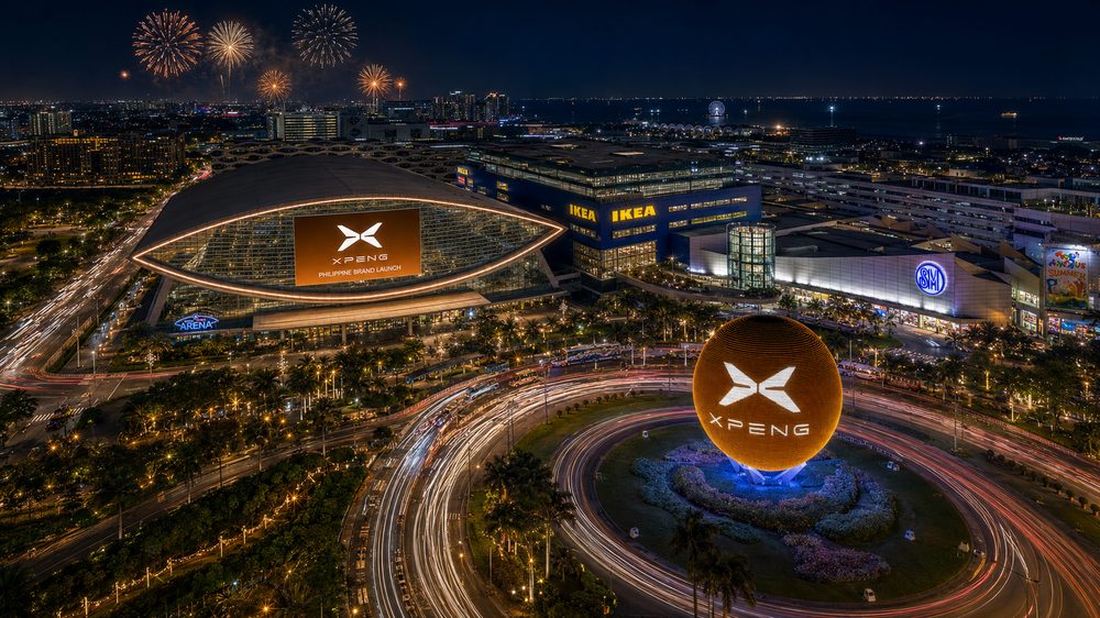 Aerial view of the Mall of Asia Complex at night with the arena lit up
