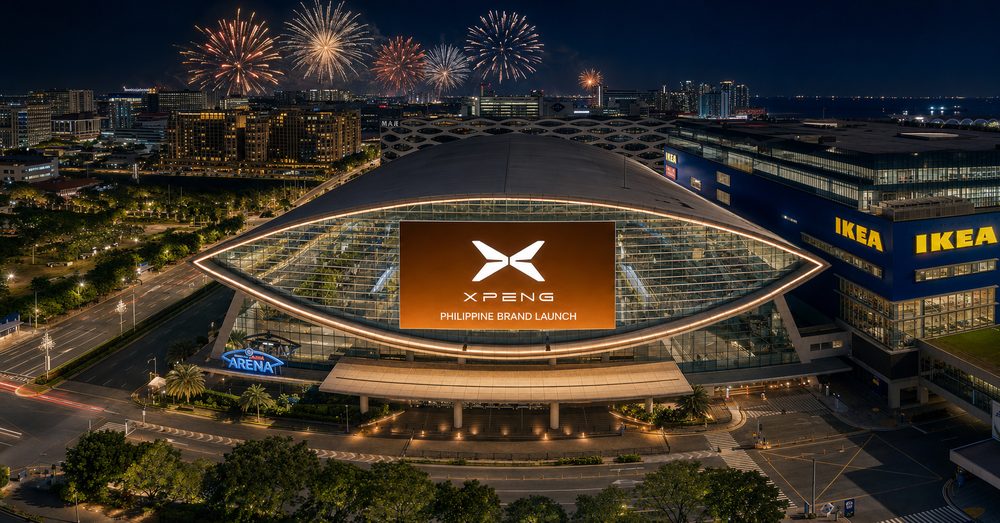 MOA Arena at night, its facade screen carrying the XPENG mark